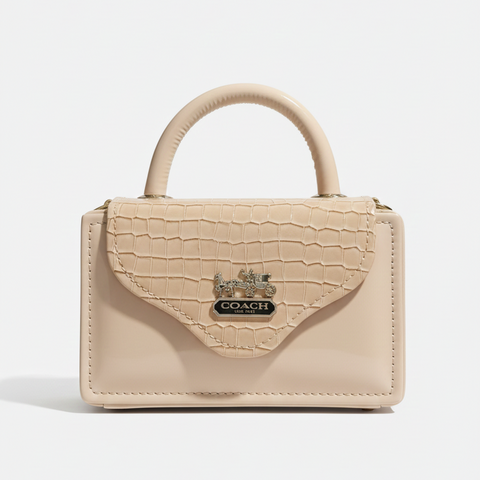 Beige handbag with a brand logo on a white background