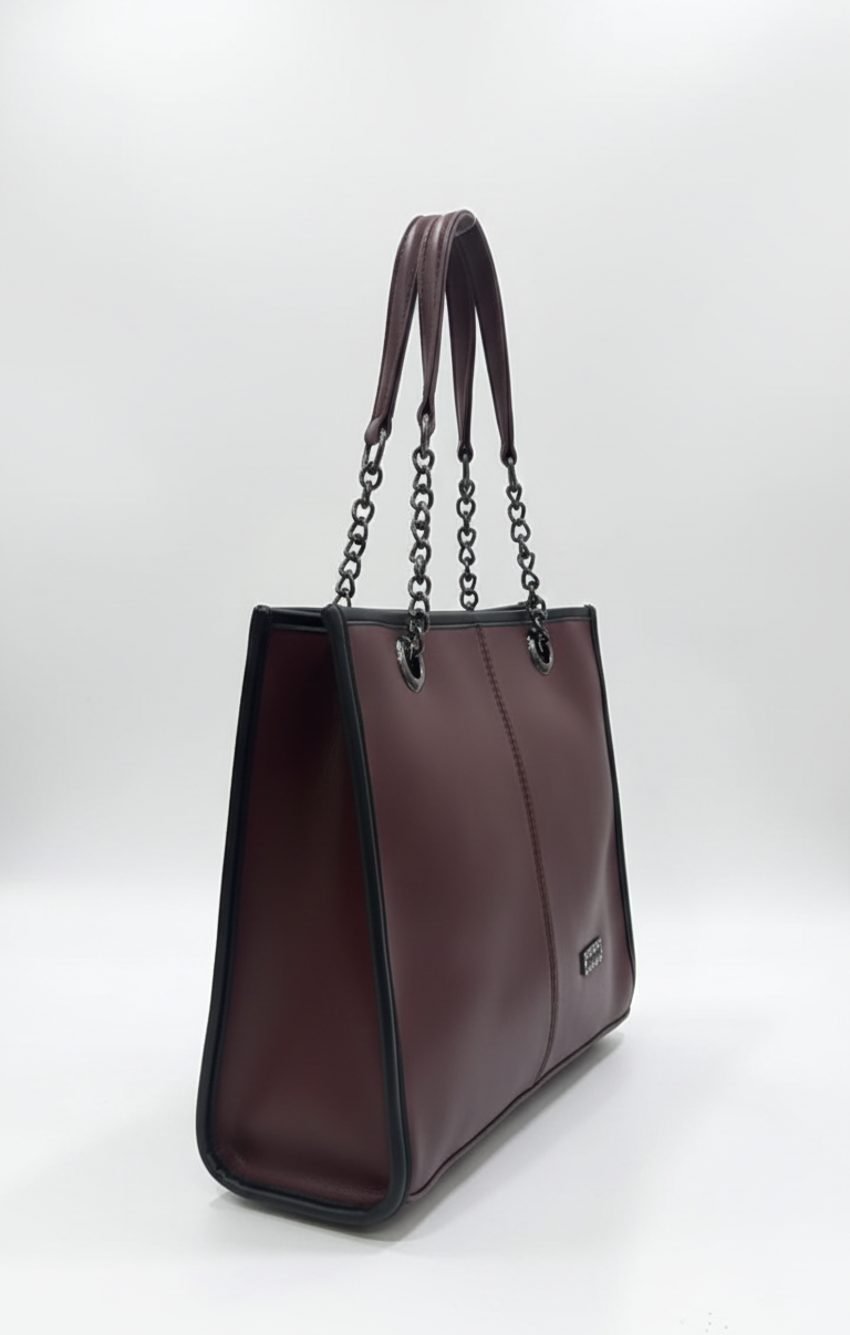 Brown handbag with chain strap on a white background