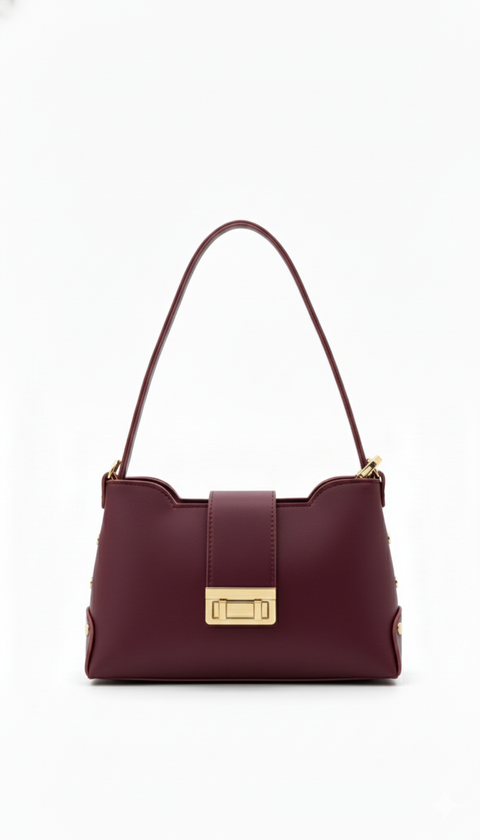 Burgundy handbag with a gold clasp on a white background